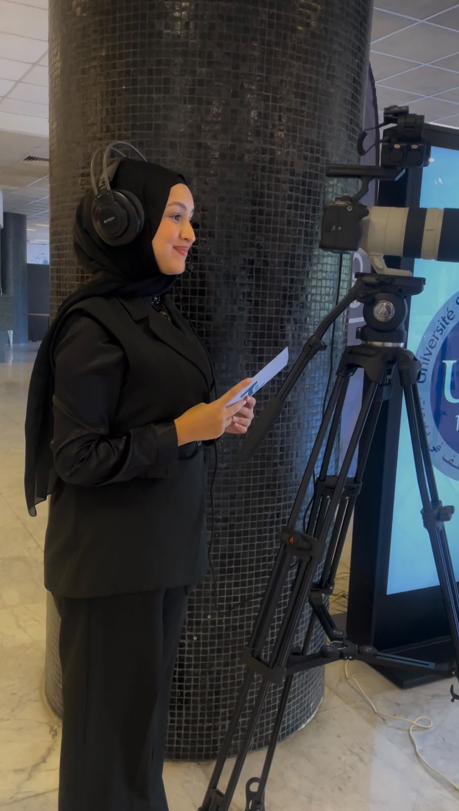 Dania operating a camera during production training